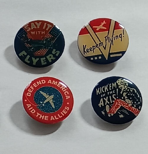 Set of four 1″ repro WW2 pins */ “KICK ‘EM IN THE AXIS!” */ “Keepem Flying!” ..